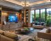 Modern living room with large windows and comfortable furniture.